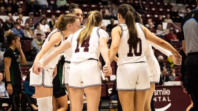 West Texas A&M huddles up to celebrate another DII women's basketball win. 