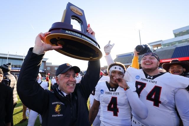 Ferris State's Tony Annese hoists the DII football championship trophy once again.